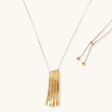 Modern adjustable necklace featuring geometric ribbed pendant with vertical lines in gold and silver finish options.